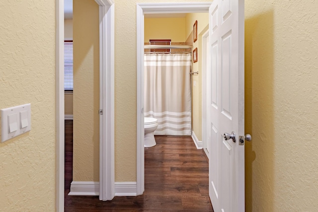 473 SW Dagget Ave, Port Saint Lucie, FL 34953 - hallway featuring a textured wall and dark wood finished floors