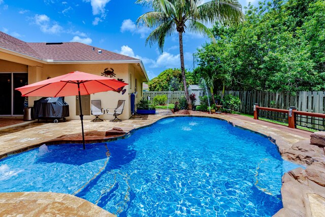 473 SW Dagget Ave, Port Saint Lucie, FL 34953 - view of pool featuring a patio and a fenced backyard