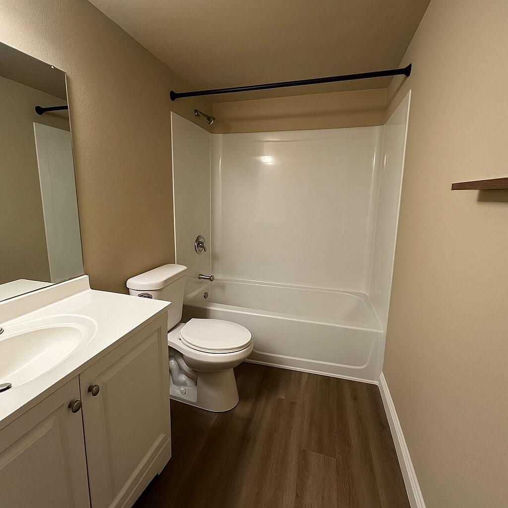 500 SW 2nd Ave Unit 120, Boca Raton, FL 33432 - full bath with wood finished floors, vanity, bathing tub / shower combination, and toilet