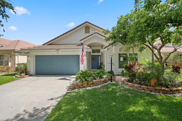 1071 Delray Lakes Dr, Delray Beach, FL 33444 - single story home featuring stucco siding, driveway, an attached garage, a front yard, and a tile roof