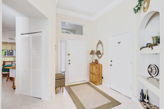 1071 Delray Lakes Dr, Delray Beach, FL 33444 - foyer entrance featuring light tile patterned floors, ornamental molding, and ceiling fan