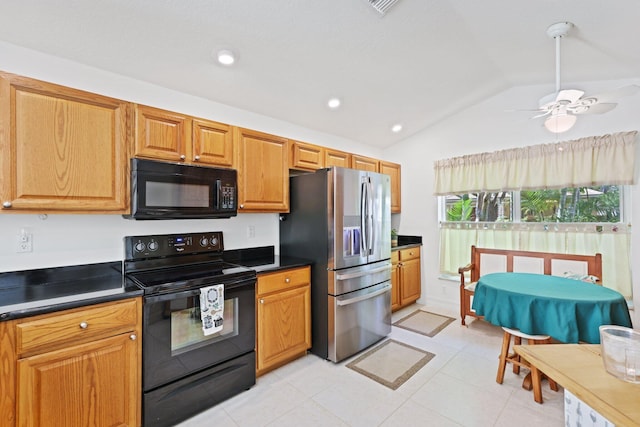 1071 Delray Lakes Dr, Delray Beach, FL 33444 - kitchen featuring black appliances, lofted ceiling, dark countertops, ceiling fan, and light tile patterned flooring
