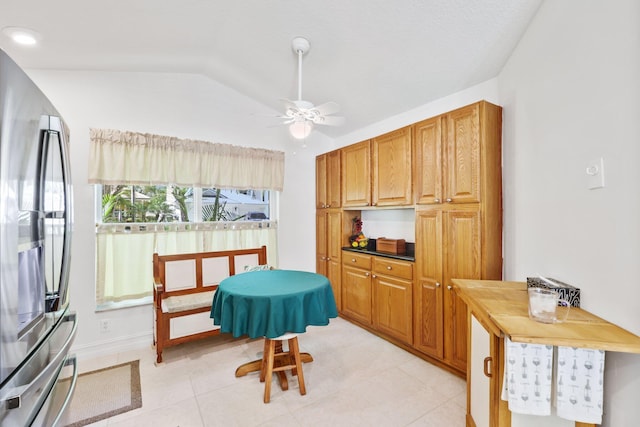 1071 Delray Lakes Dr, Delray Beach, FL 33444 - sitting room featuring ceiling fan, lofted ceiling, light tile patterned floors, and baseboards