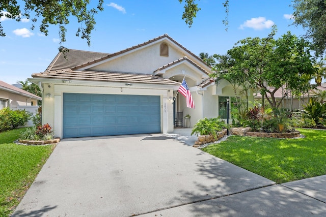 1071 Delray Lakes Dr, Delray Beach, FL 33444 - ranch-style house featuring an attached garage, concrete driveway, stucco siding, a front lawn, and a tile roof