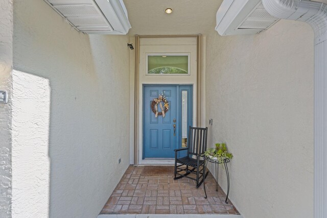 1071 Delray Lakes Dr, Delray Beach, FL 33444 - doorway to property featuring stucco siding