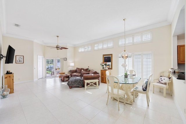 1071 Delray Lakes Dr, Delray Beach, FL 33444 - dining room with a ceiling fan, crown molding, baseboards, light tile patterned floors, and a high ceiling