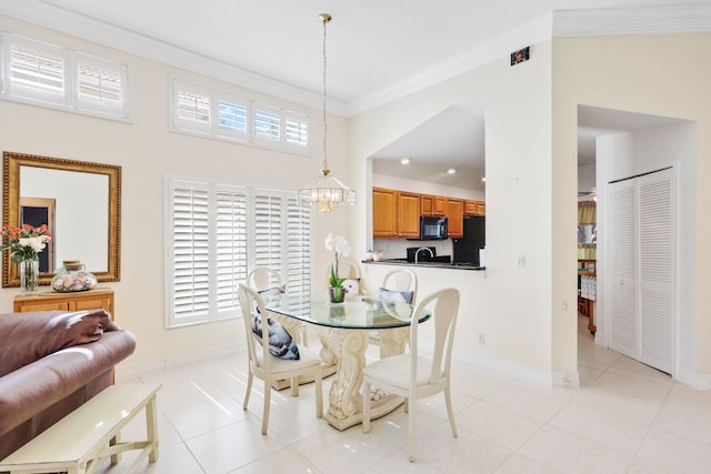 1071 Delray Lakes Dr, Delray Beach, FL 33444 - dining area with ornamental molding, a chandelier, healthy amount of natural light, baseboards, and light tile patterned flooring