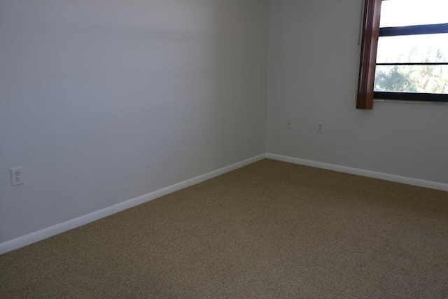 3507 Village Blvd Unit 401, West Palm Beach, FL 33409 - spare room featuring carpet floors and baseboards