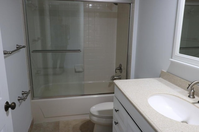 3507 Village Blvd Unit 401, West Palm Beach, FL 33409 - full bathroom with toilet, vanity, bath / shower combo with glass door, and tile patterned flooring