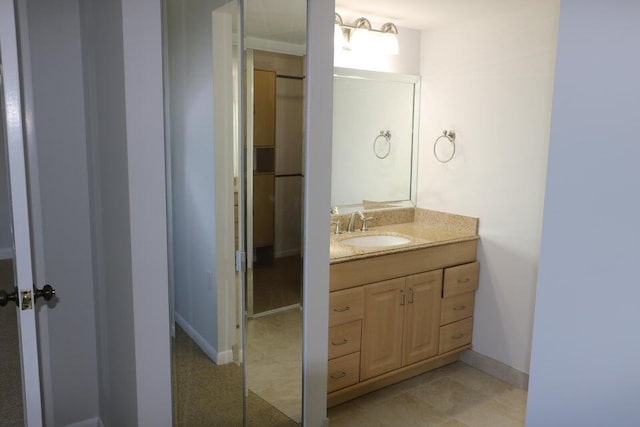 3507 Village Blvd Unit 401, West Palm Beach, FL 33409 - bathroom with vanity and baseboards