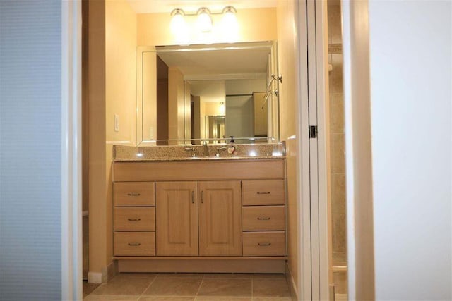 3507 Village Blvd Unit 401, West Palm Beach, FL 33409 - bathroom featuring vanity, tile patterned flooring, and baseboards