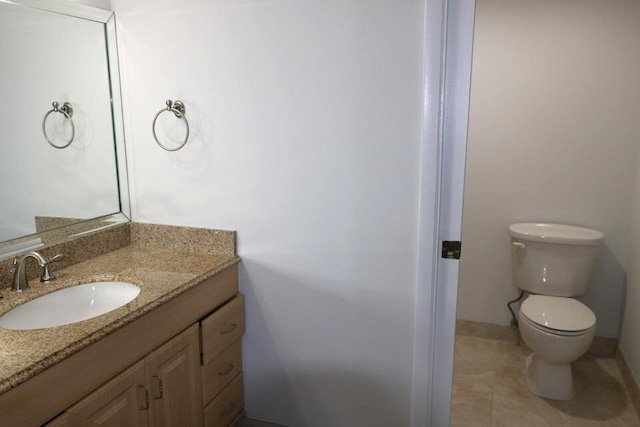3507 Village Blvd Unit 401, West Palm Beach, FL 33409 - bathroom featuring vanity, toilet, and tile patterned flooring