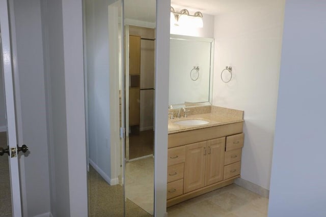 3507 Village Blvd Unit 401, West Palm Beach, FL 33409 - bathroom featuring vanity and baseboards