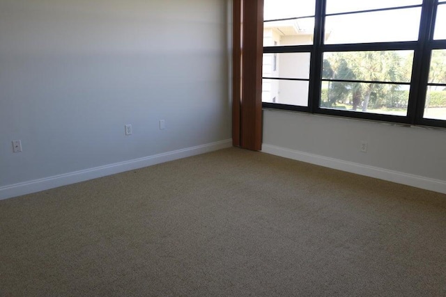 3507 Village Blvd Unit 401, West Palm Beach, FL 33409 - spare room featuring light colored carpet and baseboards