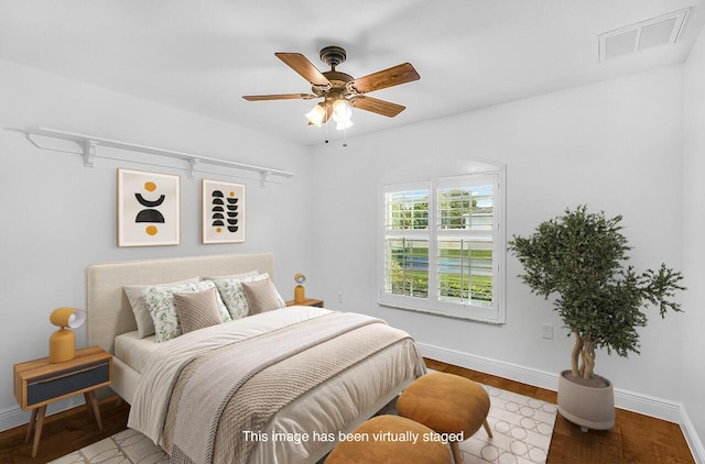 3024 Constellation Dr, Melbourne, FL 32940 - bedroom featuring a ceiling fan and wood finished floors