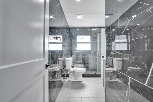 220 Walton Blvd, West Palm Beach, FL 33405 - full bath featuring toilet, a marble finish shower, recessed lighting, tile patterned floors, and tile walls