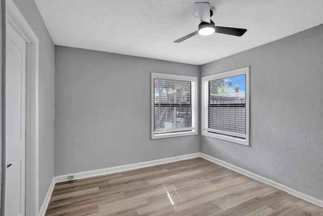 220 Walton Blvd, West Palm Beach, FL 33405 - empty room featuring a textured wall, wood finished floors, ceiling fan, baseboards, and a textured ceiling