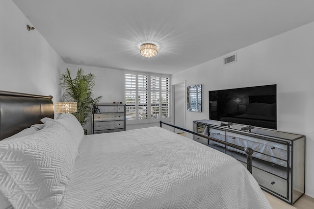 7572 Regency Lake Dr Unit 402, Boca Raton, FL 33433 - bedroom with baseboards and wood finished floors