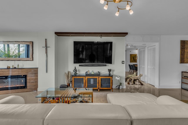 7572 Regency Lake Dr Unit 402, Boca Raton, FL 33433 - living area with a glass covered fireplace and a chandelier