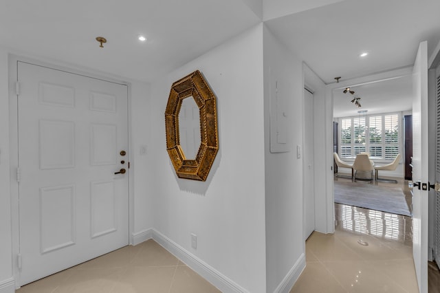7572 Regency Lake Dr Unit 402, Boca Raton, FL 33433 - foyer with light tile patterned floors, recessed lighting, and baseboards