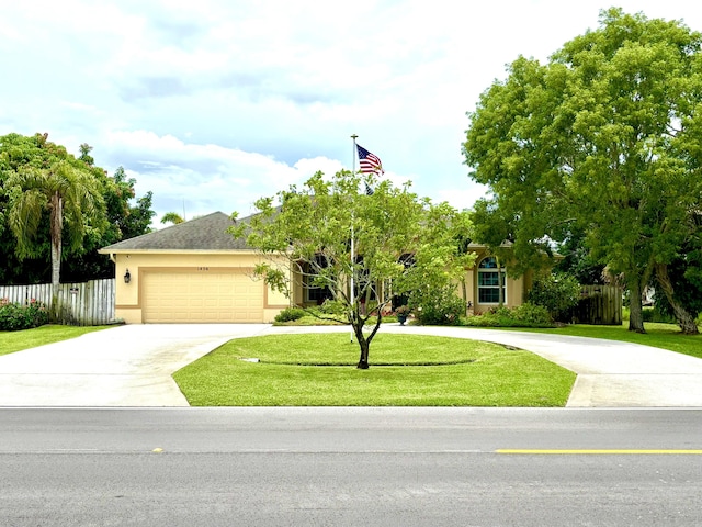 1456 SW Del Rio Blvd, Port Saint Lucie, FL 34953 - view of front of home with concrete driveway, stucco siding, and an attached garage