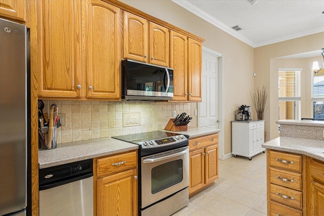 1456 SW Del Rio Blvd, Port Saint Lucie, FL 34953 - kitchen featuring appliances with stainless steel finishes, backsplash, light countertops, crown molding, and light tile patterned flooring