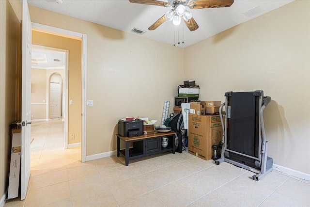 1456 SW Del Rio Blvd, Port Saint Lucie, FL 34953 - home office with ceiling fan, light tile patterned floors, baseboards, and arched walkways