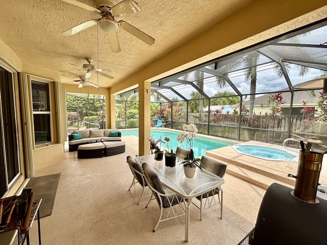 1456 SW Del Rio Blvd, Port Saint Lucie, FL 34953 - view of patio / terrace with an in-ground hot tub, ceiling fan, an outdoor pool, and a lanai