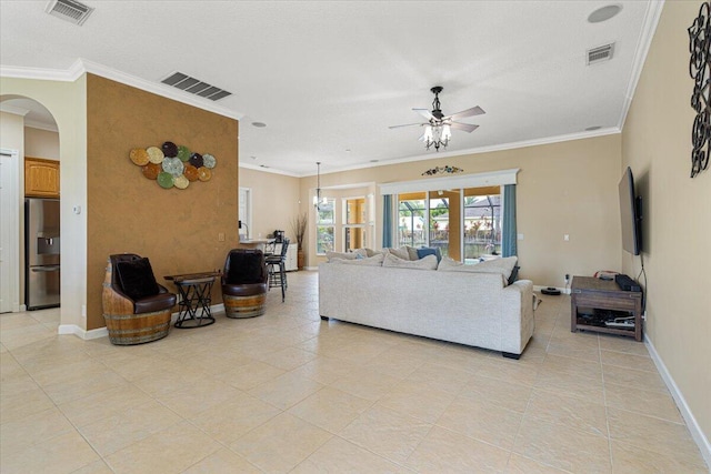 1456 SW Del Rio Blvd, Port Saint Lucie, FL 34953 - living room featuring arched walkways, a ceiling fan, ornamental molding, light tile patterned floors, and baseboards