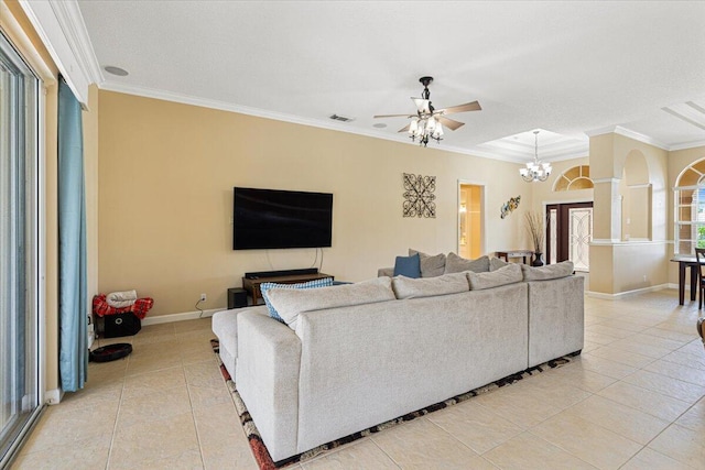 1456 SW Del Rio Blvd, Port Saint Lucie, FL 34953 - living area with light tile patterned floors, ceiling fan, a chandelier, baseboards, and ornamental molding