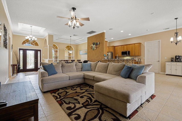 1456 SW Del Rio Blvd, Port Saint Lucie, FL 34953 - living area with crown molding, a chandelier, light tile patterned flooring, baseboards, and ceiling fan