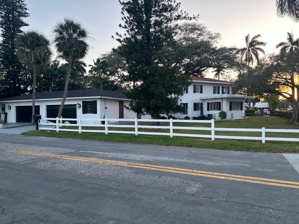 1500 S Palmway, Lake Worth Beach, FL 33460 - view of front of home with driveway and a garage