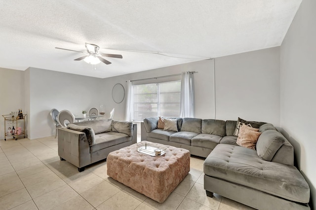 600 Pine Dr Unit 104, Pompano Beach, FL 33060 - living area with light tile patterned floors, a ceiling fan, and a textured ceiling