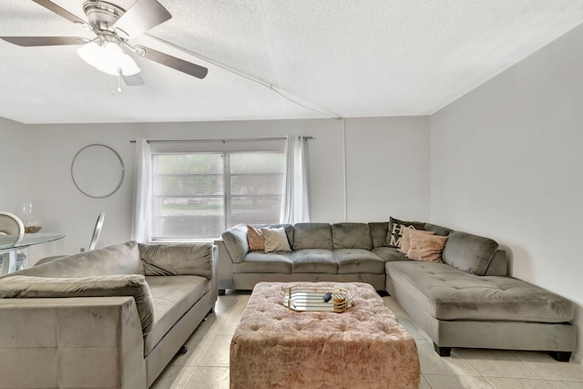 600 Pine Dr Unit 104, Pompano Beach, FL 33060 - living area with light tile patterned floors, a ceiling fan, and a textured ceiling