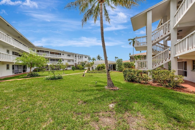 600 Pine Dr Unit 104, Pompano Beach, FL 33060 - view of home's community featuring stairway and a lawn