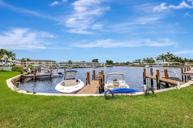 600 Pine Dr Unit 104, Pompano Beach, FL 33060 - dock featuring a water view and a lawn