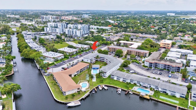 600 Pine Dr Unit 104, Pompano Beach, FL 33060 - aerial view of property and surrounding area featuring a large body of water and nearby urban area