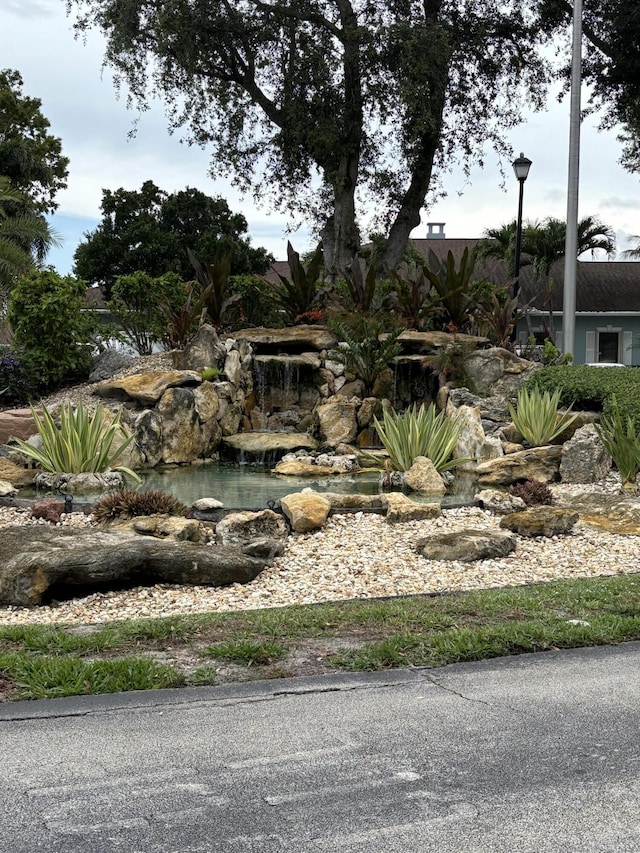 9935 Papaya Tree Trl Unit B, Boynton Beach, FL 33436 - view of yard with a small pond