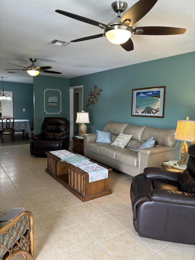 9935 Papaya Tree Trl Unit B, Boynton Beach, FL 33436 - living room with a ceiling fan, tile patterned flooring, and a textured ceiling