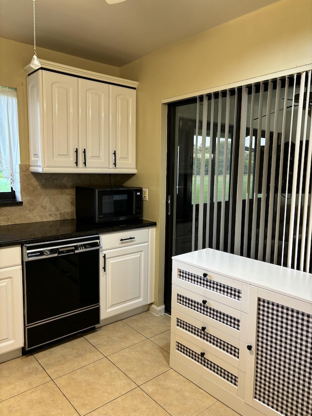 9935 Papaya Tree Trl Unit B, Boynton Beach, FL 33436 - kitchen with black appliances, white cabinetry, light tile patterned flooring, dark countertops, and backsplash