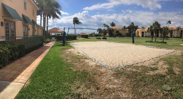 160 Yacht Club Way Unit 309, Hypoluxo, FL 33462 - view of property's community with volleyball court, a yard, and a residential view
