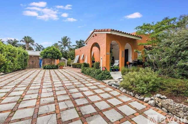 616 Claremore Dr Unit 1, 2, 3, West Palm Beach, FL 33401 - view of patio featuring a gate