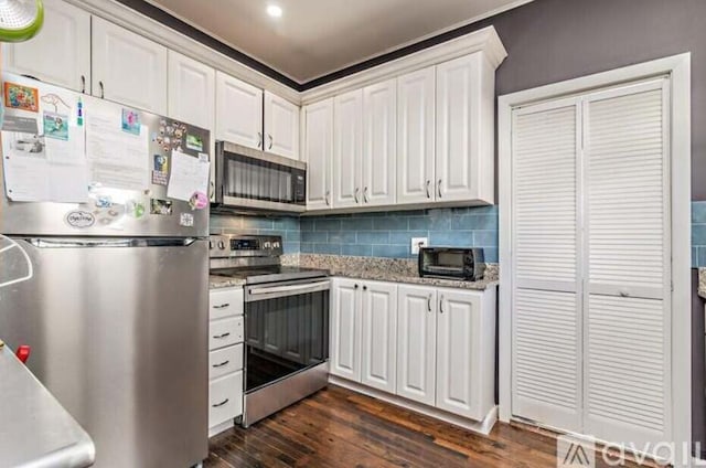 616 Claremore Dr Unit 1, 2, 3, West Palm Beach, FL 33401 - kitchen with stainless steel appliances, white cabinetry, dark wood-style flooring, backsplash, and light stone counters