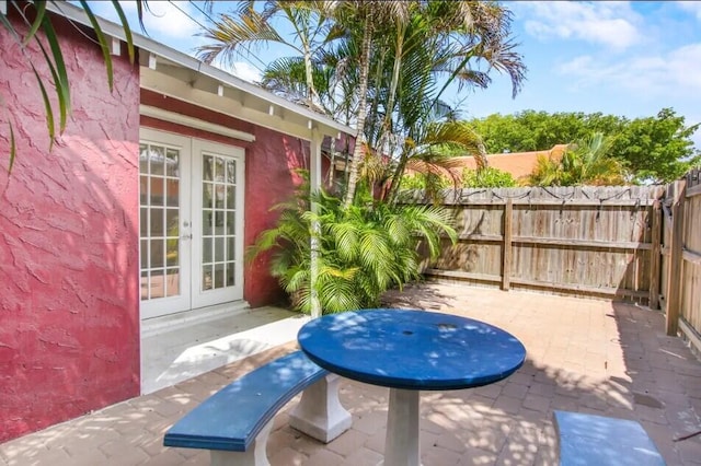 616 Claremore Dr Unit 1, 2, 3, West Palm Beach, FL 33401 - view of patio / terrace featuring french doors