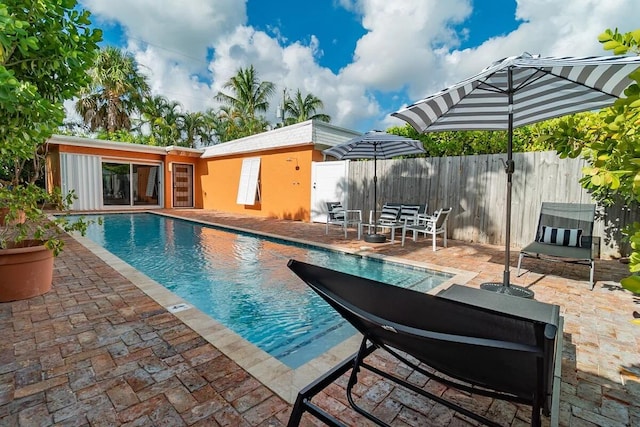 616 Claremore Dr Unit 1, 2, 3, West Palm Beach, FL 33401 - view of swimming pool featuring a patio
