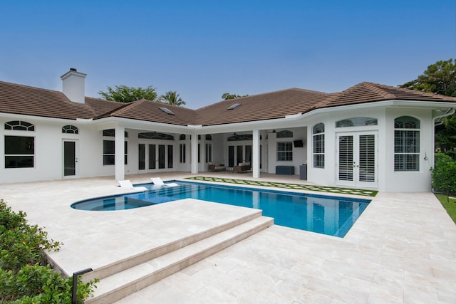 8246 Man O War Rd, Palm Beach Gardens, FL 33418 - view of pool featuring french doors, ceiling fan, outdoor lounge area, a patio, and a pool with connected hot tub