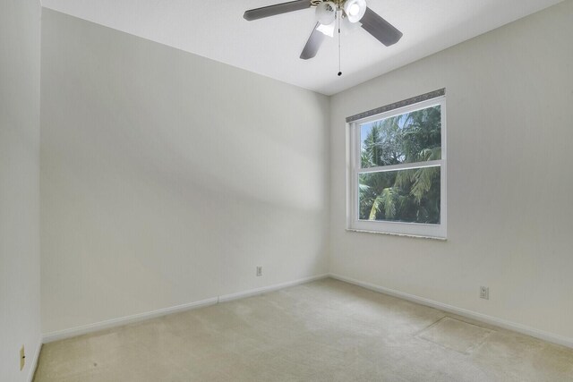 6164 C Durham Dr, Lake Worth, FL 33467 - spare room with light colored carpet, a ceiling fan, and baseboards