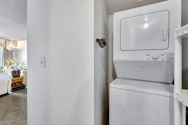 3589 S Ocean Blvd Unit 908, South Palm Beach, FL 33480 - laundry room featuring stacked washer and clothes dryer