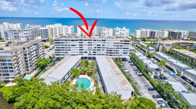 3589 S Ocean Blvd Unit 908, South Palm Beach, FL 33480 - bird's eye view of apartment complex / building, a pool area, and a nearby body of water