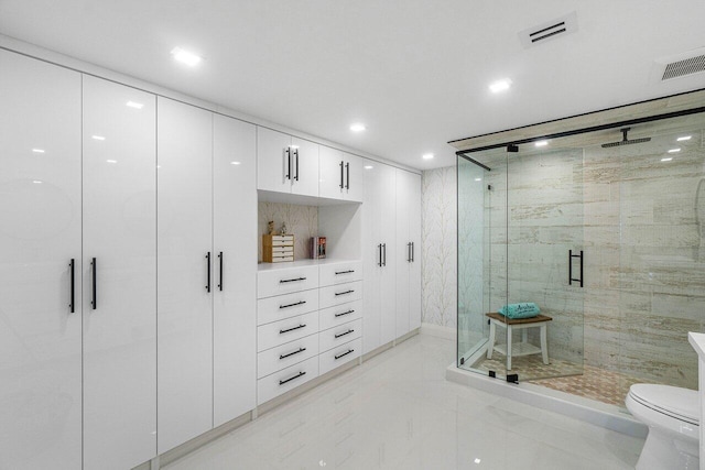 875 E Camino Real Unit 3E, Boca Raton, FL 33432 - bathroom with a stall shower, toilet, marble finish flooring, and recessed lighting